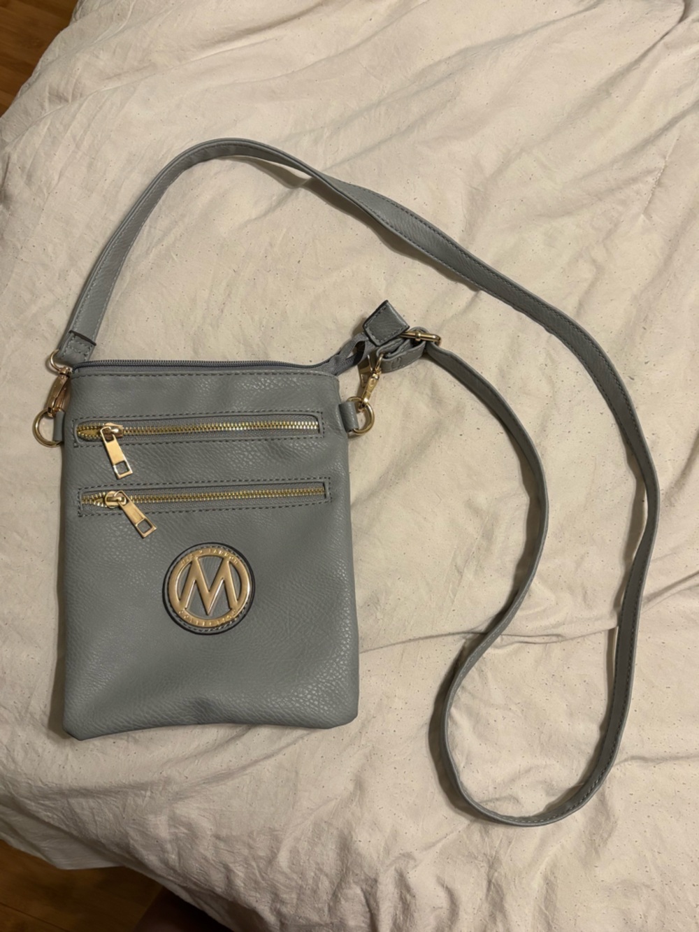 Stylish Gray Crossbody Bag with Gold Accents